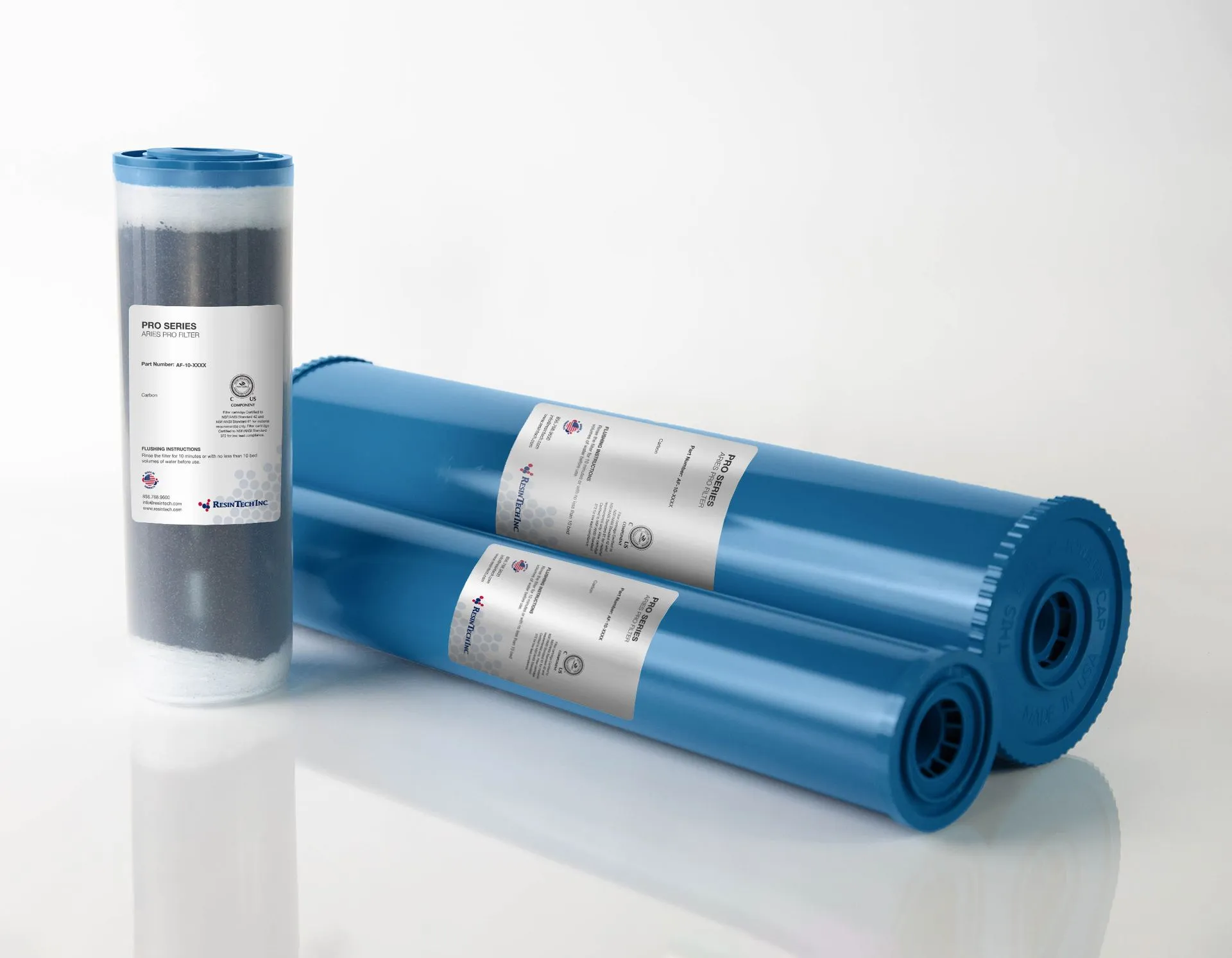 Three blue bags are stacked on top of each other on a white surface.